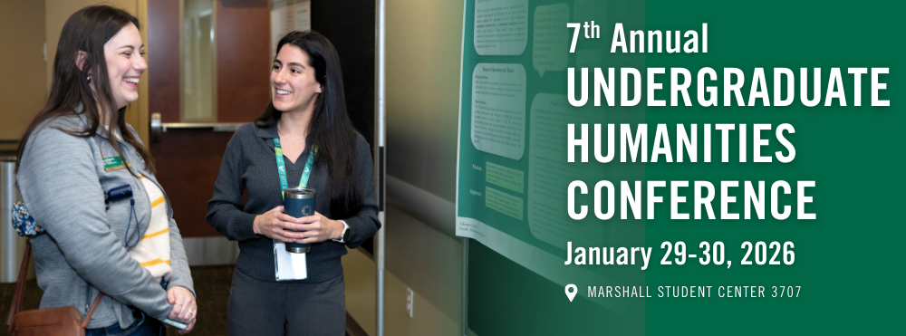 2 students standing at poster board
