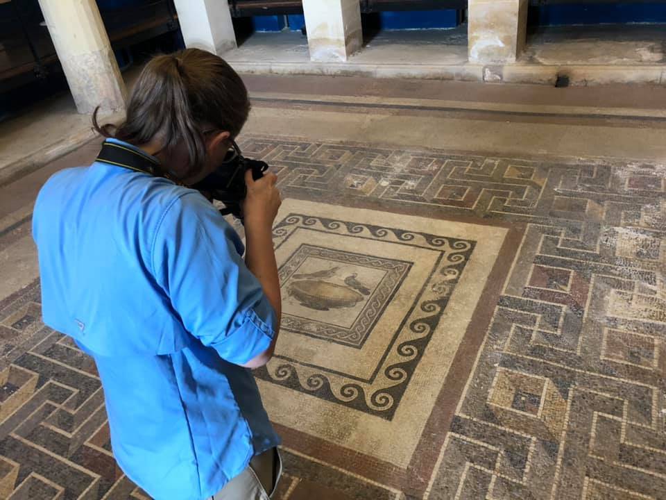 student photographing building interior