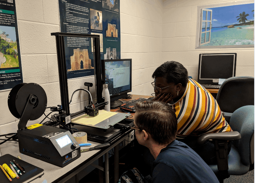 volunteers studying artifact