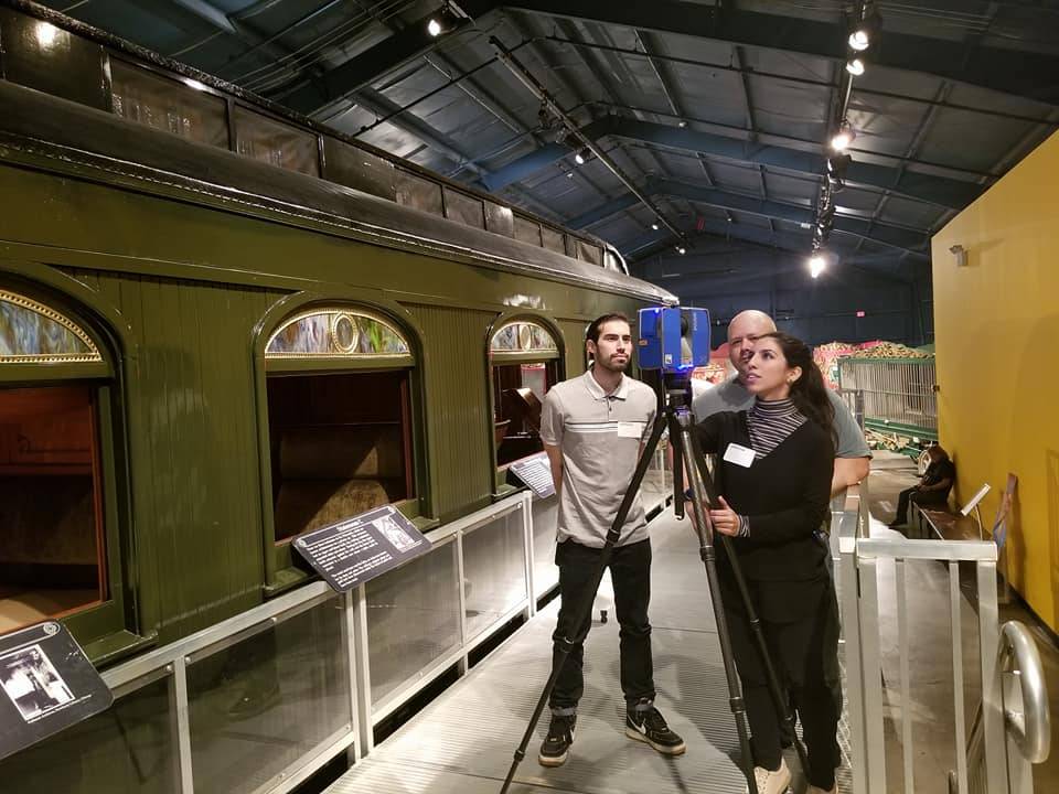 students viewing traincar