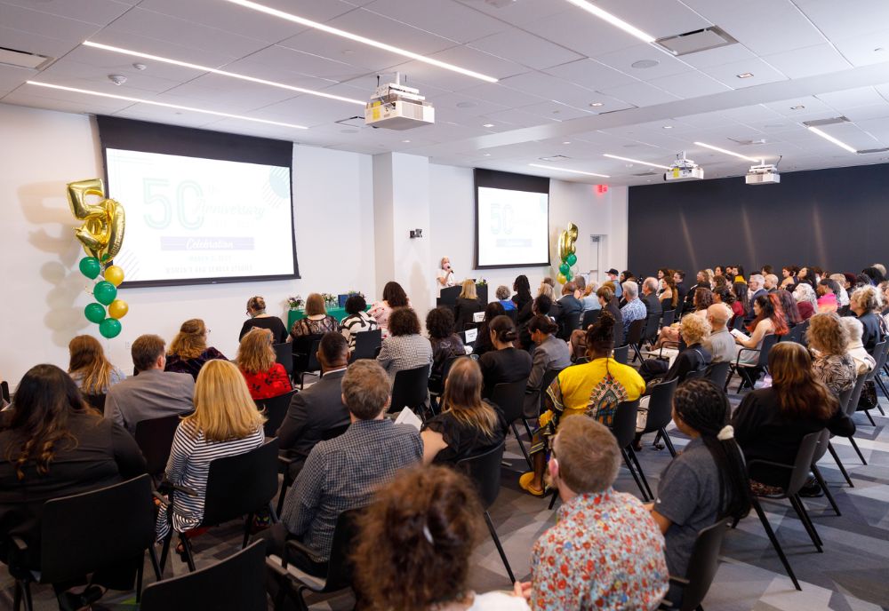 Attendees at the Women’s and Gender Studies 50th Anniversary event gather to celebrate the program (Photo credit: Aaron Lockwood Photography)