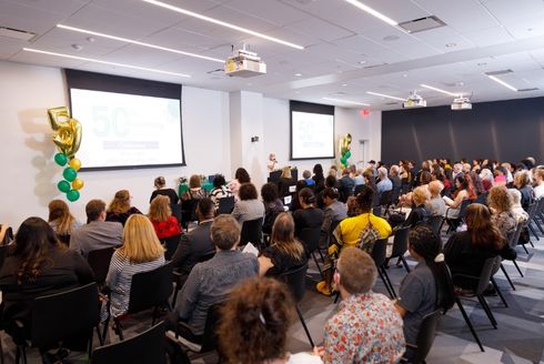 Attendees at the Women’s and Gender Studies 50th Anniversary event gather to celebrate the program (Photo credit: Aaron Lockwood Photography)