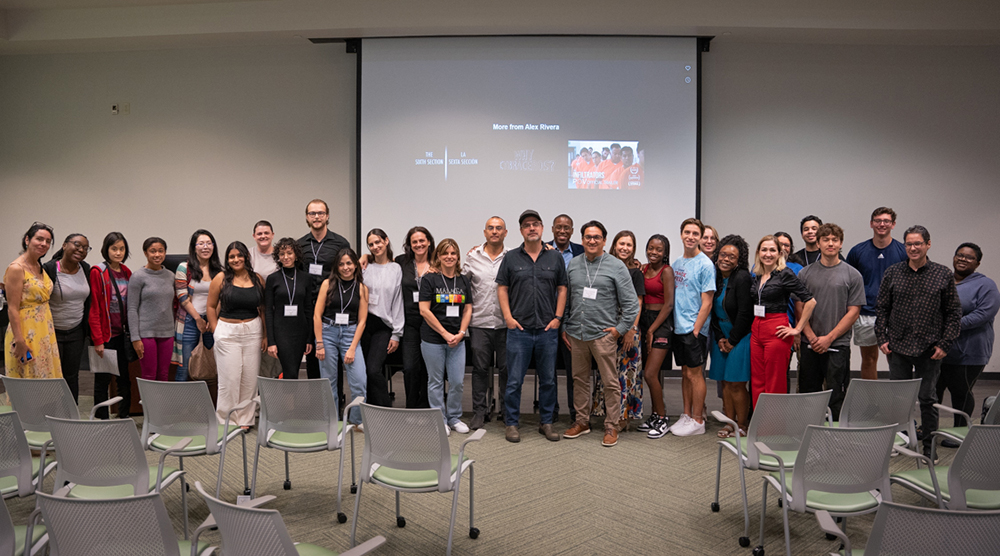 2023 Spanish Fair and Expo attendees stand for a photo with Director Alex Rivera, the event’s keynote speaker whose film “Los Infiltrados” was featured for a special screening. (Photo by Alessandra Casanova)