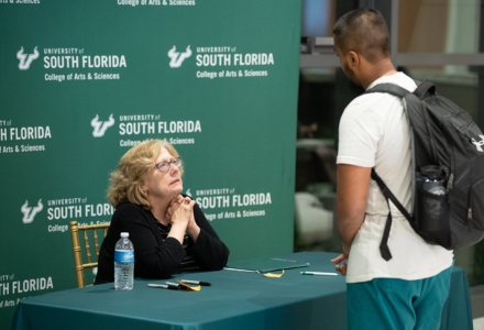 Attendees had a chance to speak with Dr. Kaveny following the discussion during the book signing portion of the evening. (Photo by Corey Lepak)