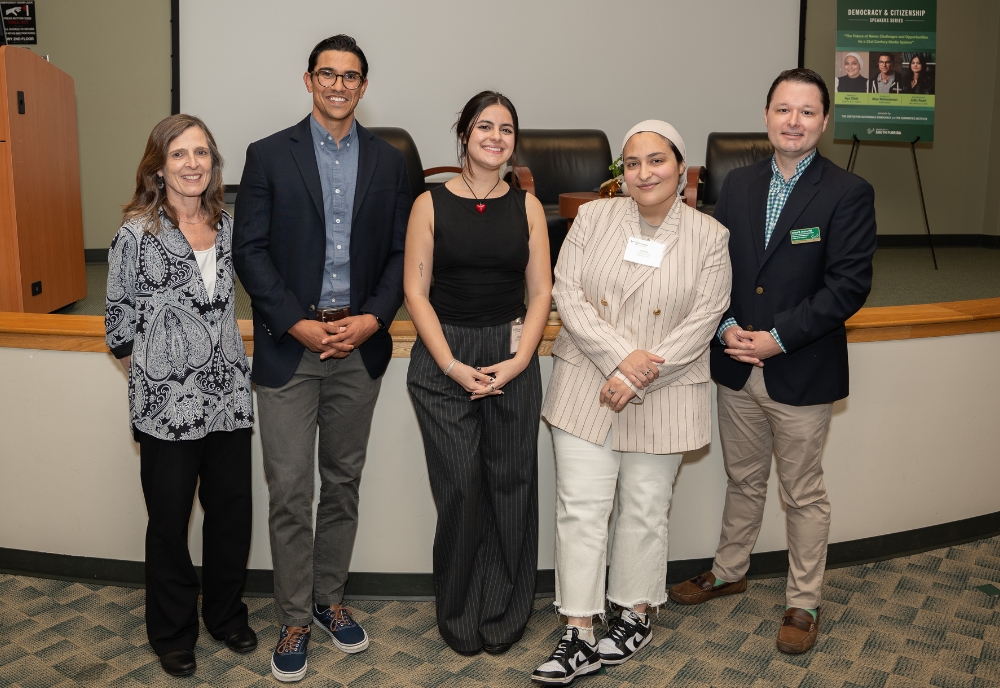 (From left) CAS Interim Dean Magali Michael with panelists Alex Mahadeven (director of MediaWise at the Poynter Institute), Julia Saad (mass communications senior and news editor of the USF Oracle), Aya Diab (doctoral communications student and Tampa Bay Times reporter), and Dr. Josh Scacco (associate professor in the Department of Communication and director of the Center for Sustainable Democracy). (Photo by Corey Lepak)