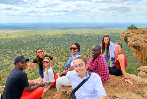 Students enjoying ‘lunch with a view’ from an outlook in Mbrikiani Ranch, Kajiado County, Kenya. They made the trek with a Maasai man who brought them there when we they asked him for a nice spot to have lunch. (Photo courtesy of Dr. Dillon Mahoney)