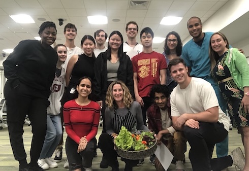 Members of the Health Buddies at USF club meet with dietitian and nutritionist Wendy Wesley (center, front row) during a training session for the program.