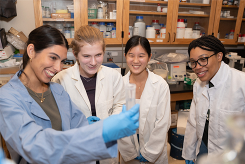 Jaiden Brick, Hannah Kirschenmann, Jade Fei, and Krystal Walford working on their proposal for the Student Spaceflight Experiment Program competition, a national competition allowing groups of interdisciplinary students to combine their areas of expertise. (Photo by Corey Lepak)