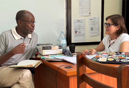 Dr. McLauchlan meeting with one of the Center’s researchers, Dr. George Okiror, whose work focuses on strengthening constitutionalism and the rule of law. (Photo courtesy of Judithanne Scourfield McLauchlan)