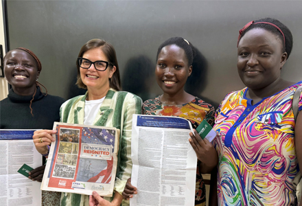 Dr. McLauchlan with attendees after her “America@250” lecture, alongside handouts featuring the U.S. Constitution and Democracy Reignited, a publication created with the Florida Humanities Council and Newspapers in Education. (Photo courtesy of Judithanne Scourfield McLauchlan)