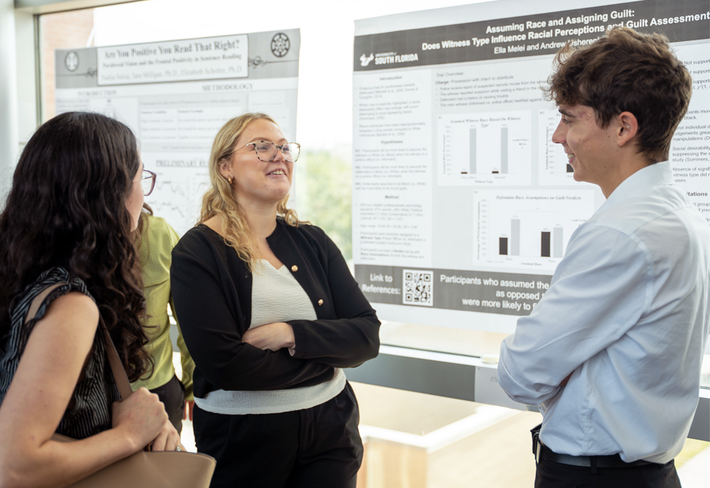 Third-place poster presentation winners Ella Melei and Andrew Usherenko presenting their project, ‘Assuming Race and Assigning Guilt: Does Witness Type Influence Racial Perceptions and Guilt Assessments?’ (Photo by Dakota Galvin)