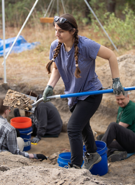 PhD student Tuesday Frasier instructed the “Advanced Buried Body” workshop, working with participants excavating a mass grave. (Photo by Corey Lepak)
