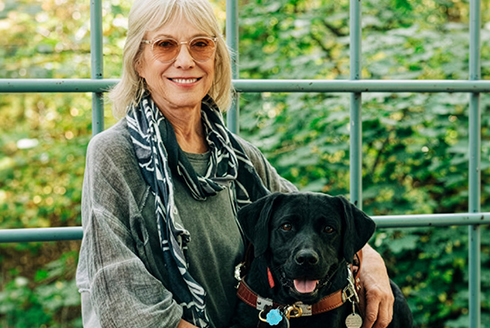 Dr. Deni Elliott and her guide dog