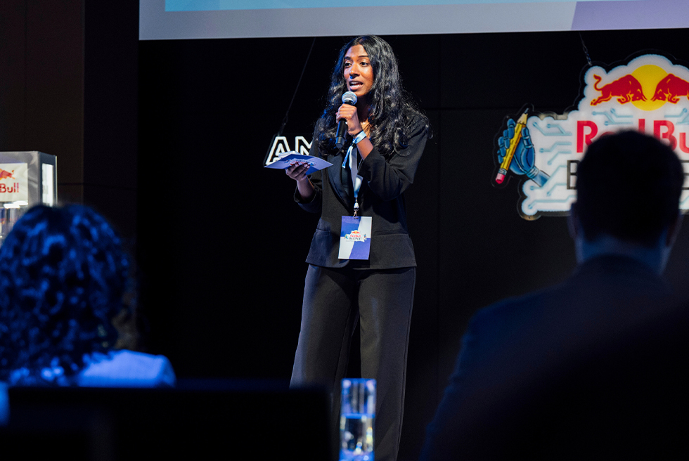 Sahasra Upputuru speaks on stage at Red Bull Basement finals
