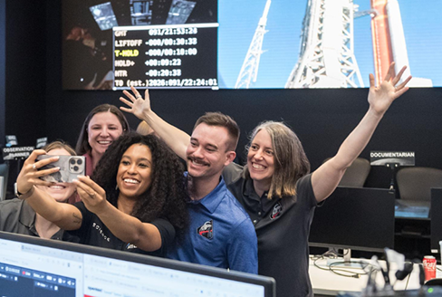 Jacob Richardson with members of the Artemis lunar science team celebrating a successful launch