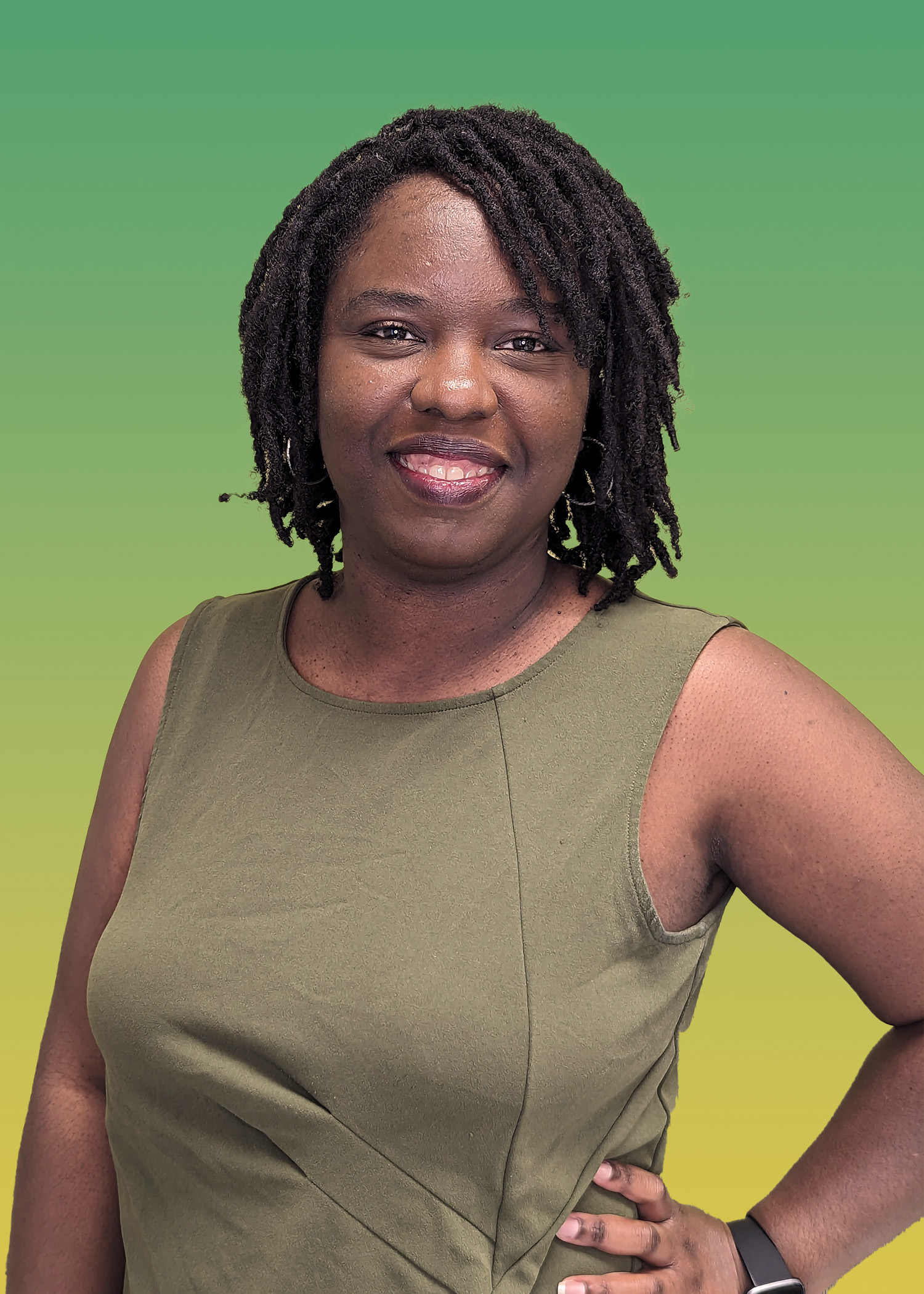 Portrait of Ashley Sowell in Green Sleeveless Blouse. 