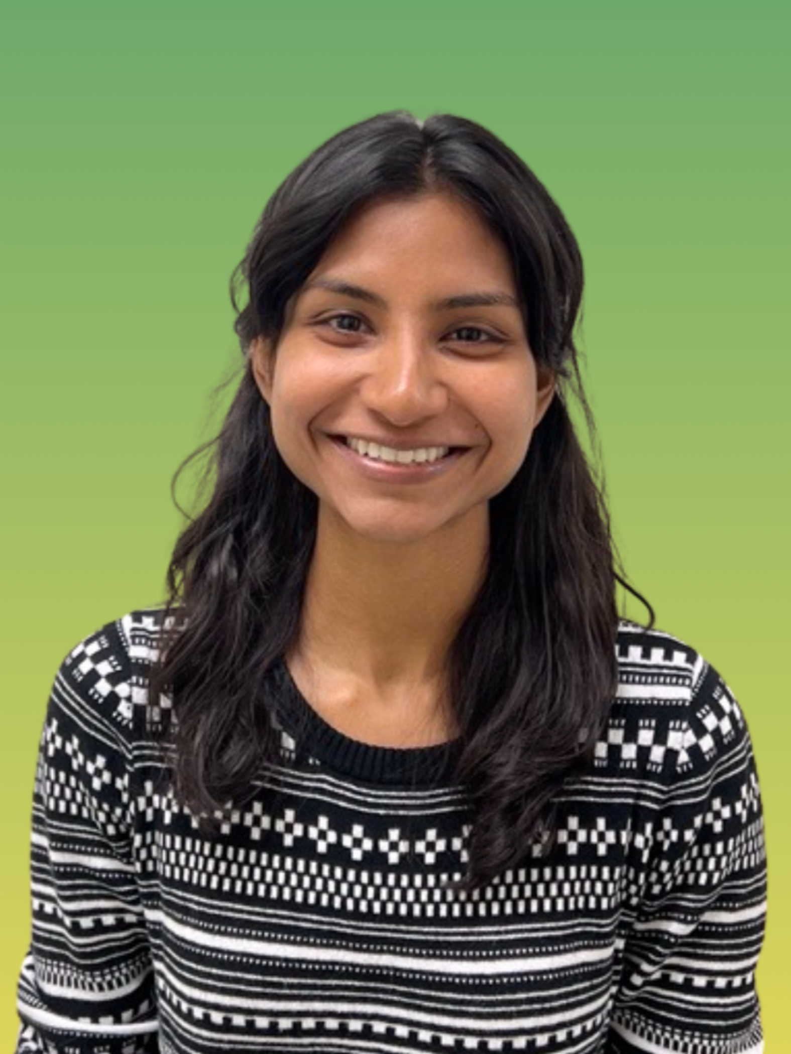 Portrait of Ashly Kuruvilla in a black and white pattern top