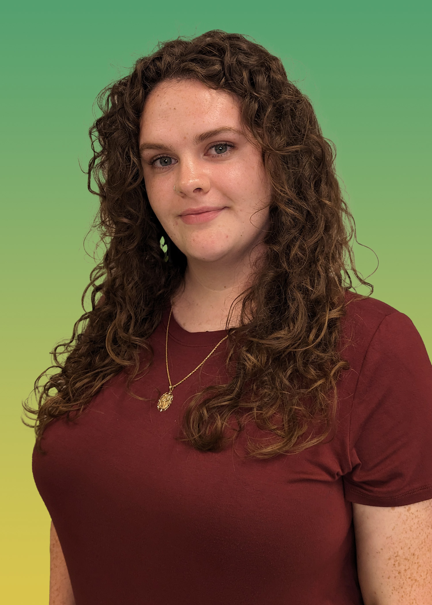 Portrait of Caroline Mynatt in a Maroon Shirt.