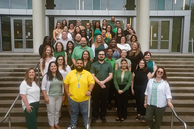 Group photo of CAS advisors standing on stairs outside