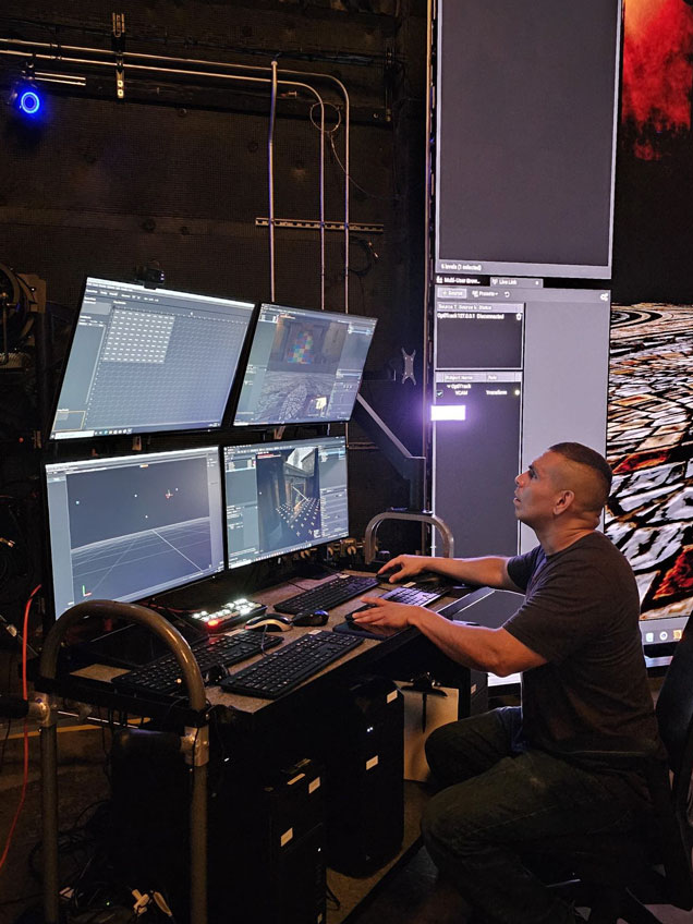 Leon Cruz working at a video wall