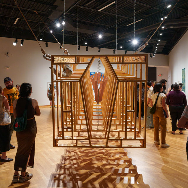 Students view the piece Gone Fishing, Out for a Swim, 2025, by Michael Lonchar, at the annual ArtHouse open house.