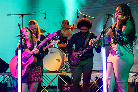 Students perform folk music.