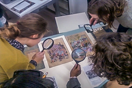 Students examining art