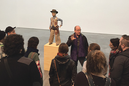 Visiting Scholar Jerry Saltz speaks to a group of students.