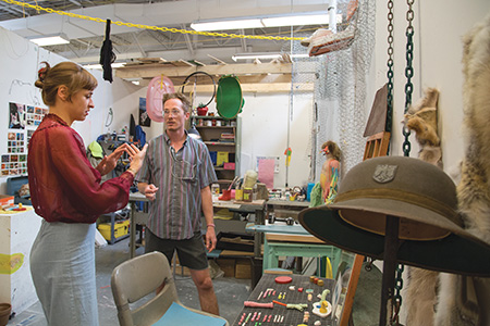 Visiting artist Basama Al-Sharif visit's MFA student's studio to discuss artwork.