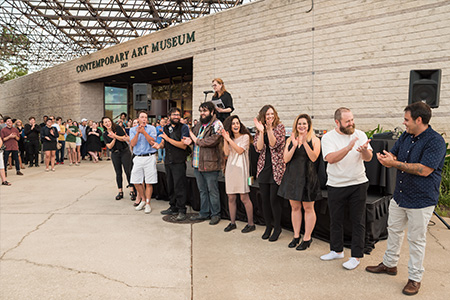 Margaret Miller presenting the MFA Studio Art students exhibiting at the USF Contemporary Art Museum.