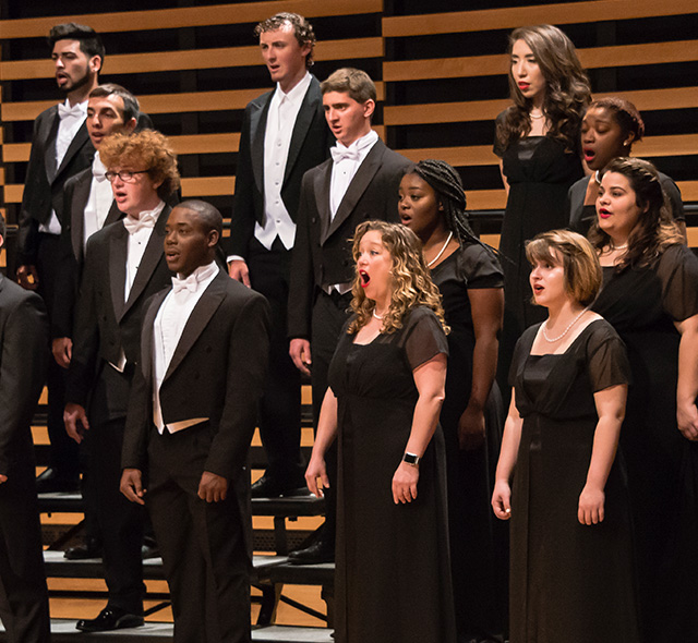 Choir students performing a song.