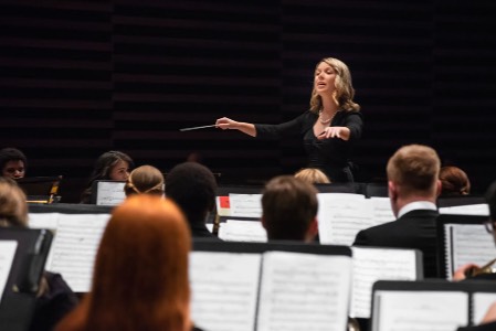 a conductor leading an orchestra