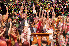 Students throwing confetti during their Graduation Celebration. Photo by Jesus Gogo