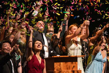 Students throwing confetti during their Graduation Celebration. Photo by Jesus Gogo