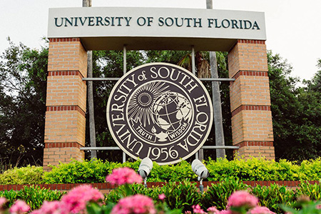 University of South Florida's academic seal at the front entrance of the Tampa campus.