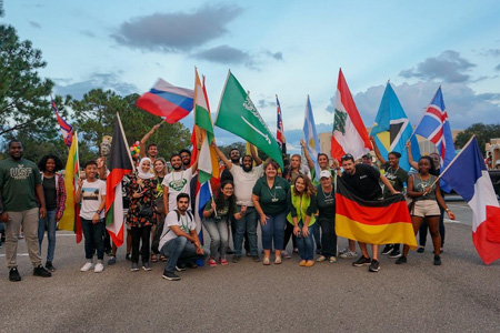 USF intenational students holding flags from different countries.