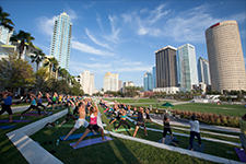 Visit Tampa Bay - Photo of people doing yoga at Curtis Hixon Waterfront Park in downtown Tampa