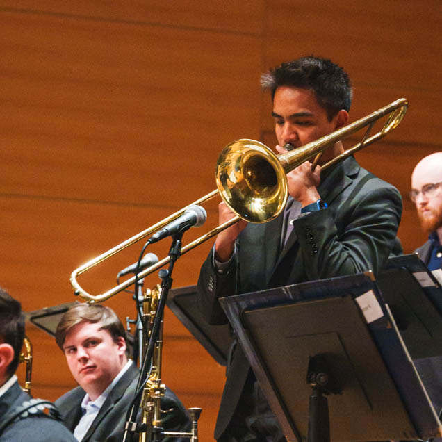 Student playing a trombone