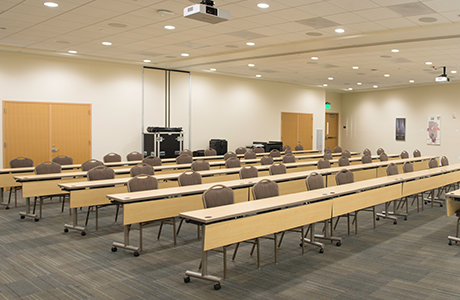 View of chairs and tables from front of conference room.