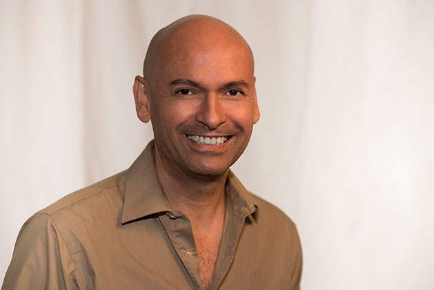 studio portrait of Cesar Cornejo with a white background