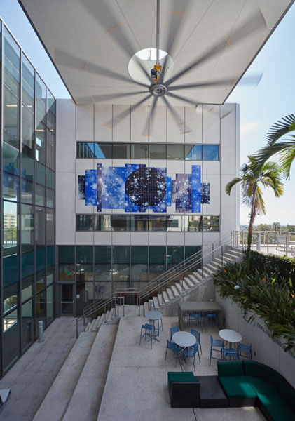 vertical photo of Sandra Cinto's "The Invisible Telescope" installation above a courtyard at the Kate Tiedemann College of Business