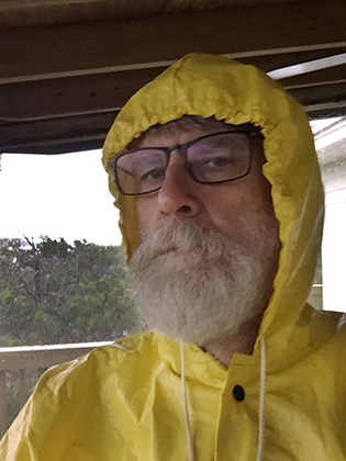 selfie photo of Bradlee Shanks in a yellow raincoat