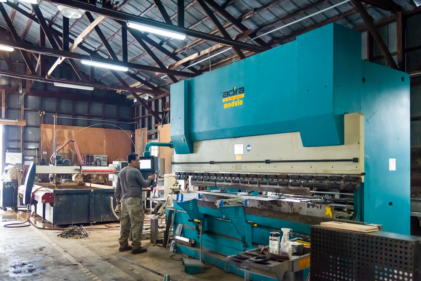 photo the hydraulic brake and waterjet machines at Modulo Design Studio in Tampa. Photography by Bryce Womeldurf.