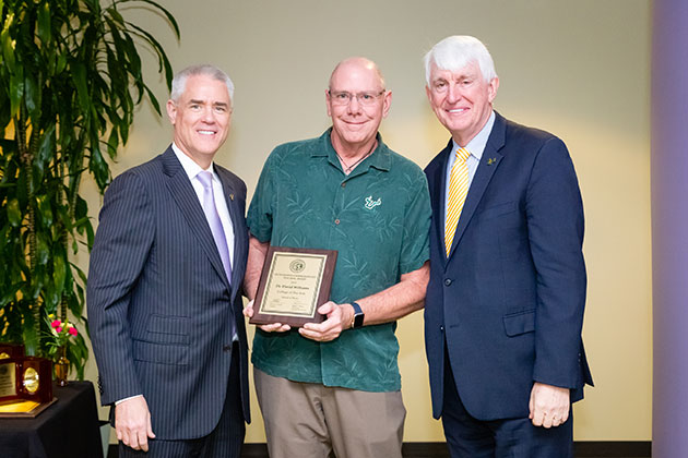 David Williams with USF President Steve Currall and USF Provost Ralph Wilcox at the USF awards reception