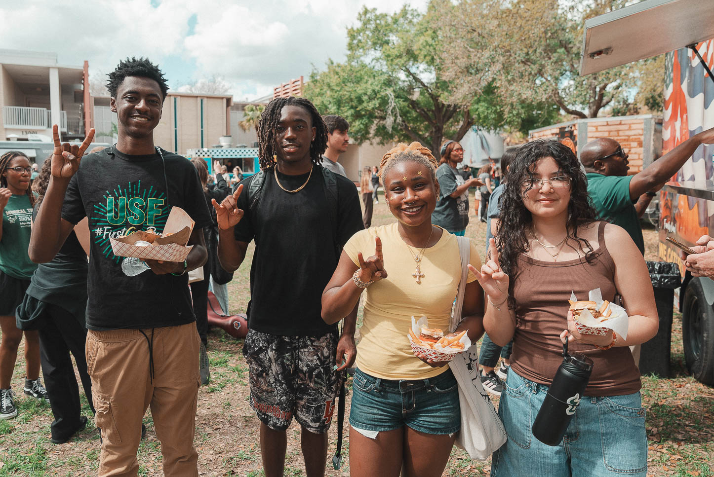 Students give the "horns up" salute.