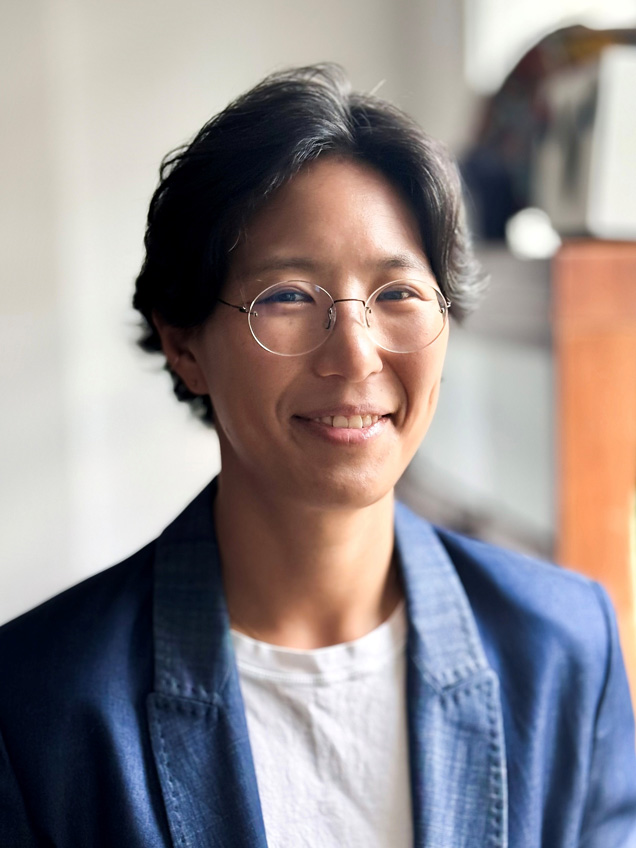 Dr Kim wearing a blue jacket