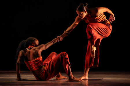 Two students dance together.