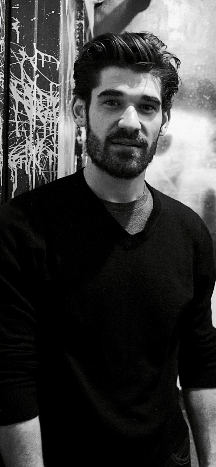 Steven Lewis wearing a black sweater