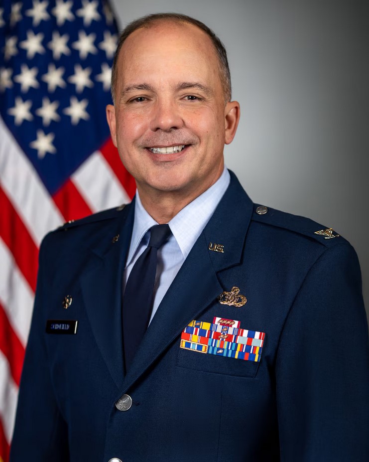 Headshot image of Don Schofield wearing a military uniform in front of an American flag.