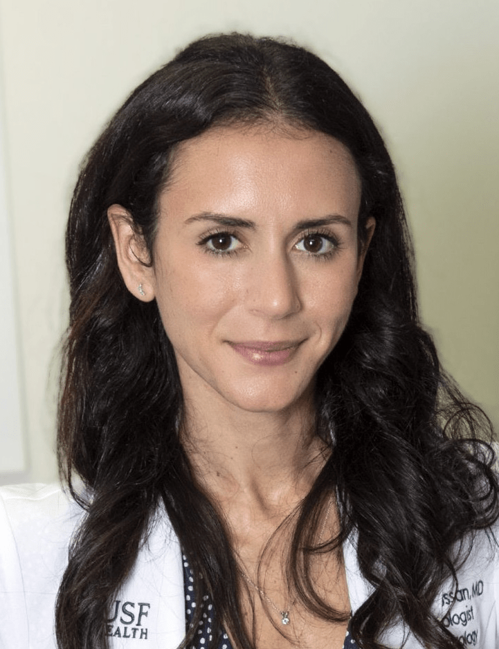 Yaël Bensoussan wearing a white lab coat